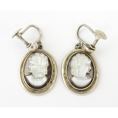 695 - A Continental .800 silver suite of jewellery with mother of pearl carved cameo detail comprising ear... 