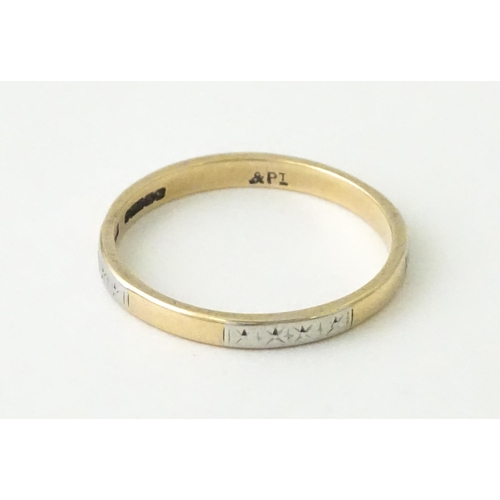 698 - A 9ct gold ring with platinum detail. Ring size approx. P