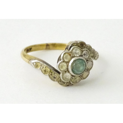 704 - An 18ct gold ring with platinum set topaz and white stones. Ring size approx. J 1/2