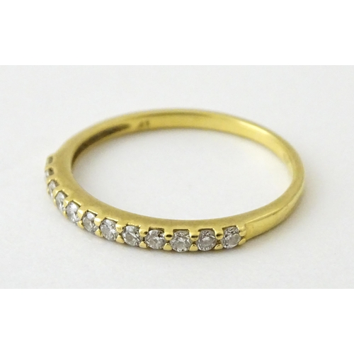 707 - An 18ct gold half eternity ring set with diamonds. Ring size approx. L