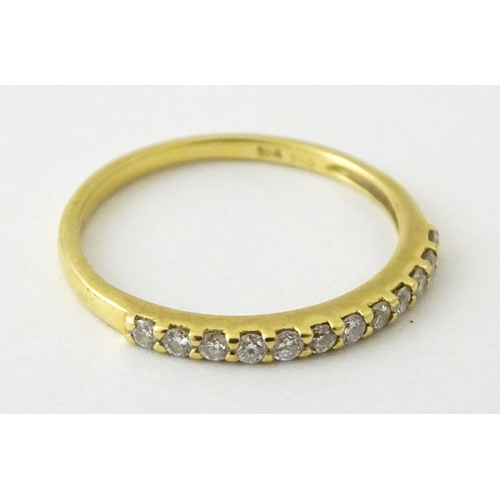 707 - An 18ct gold half eternity ring set with diamonds. Ring size approx. L