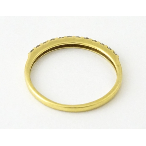 707 - An 18ct gold half eternity ring set with diamonds. Ring size approx. L