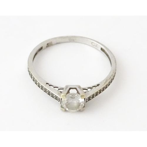 708 - A 9ct white gold ring set with cubic zirconia. Ring size approx. R 1/2