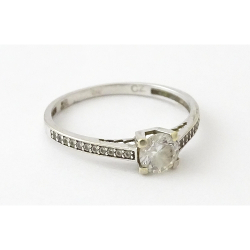 708 - A 9ct white gold ring set with cubic zirconia. Ring size approx. R 1/2