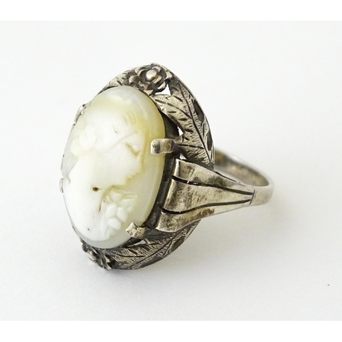 715 - A Continental silver ring set with central cameo style detail. Ring size approx. O