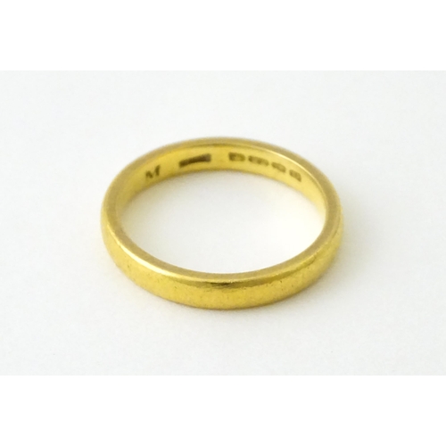 718 - A 22ct gold wedding band Ring size approx. L 1/2