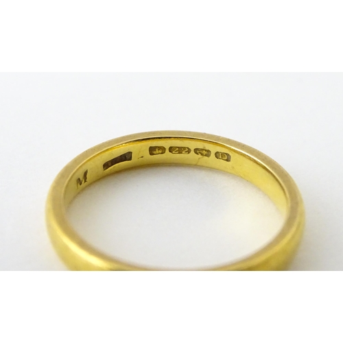 718 - A 22ct gold wedding band Ring size approx. L 1/2