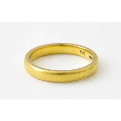 718 - A 22ct gold wedding band Ring size approx. L 1/2