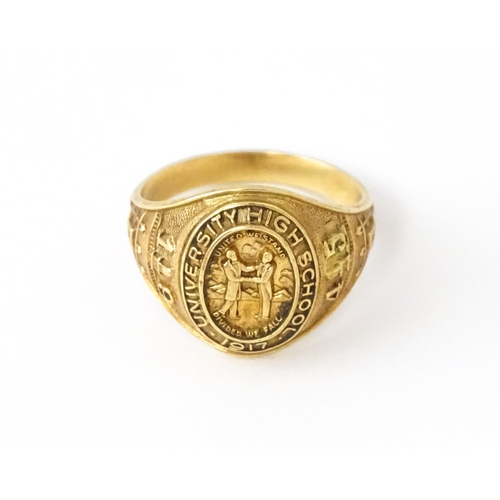 722 - An American 10k gold school ring for ' University High School' bearing motto United we stand divided... 