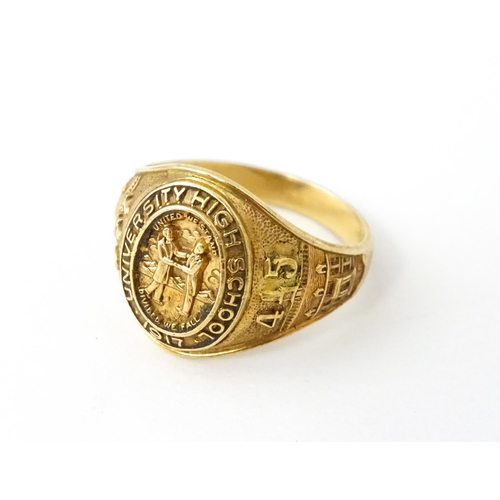 722 - An American 10k gold school ring for ' University High School' bearing motto United we stand divided... 