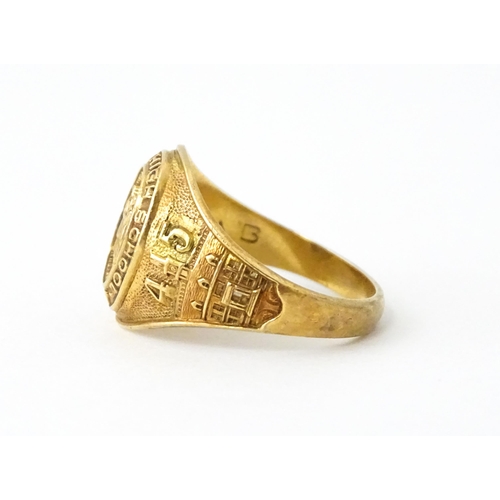 722 - An American 10k gold school ring for ' University High School' bearing motto United we stand divided... 