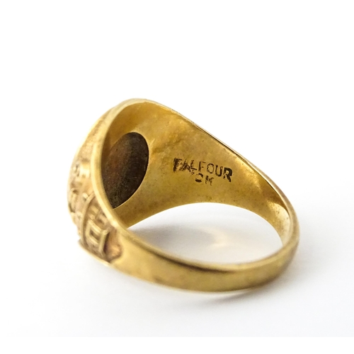 722 - An American 10k gold school ring for ' University High School' bearing motto United we stand divided... 