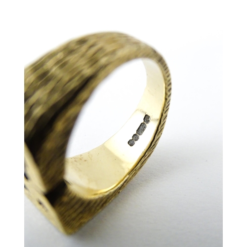 726 - A 9ct gold ring formed as the initials 'BS'. Ring size approx. N 1/2  (14g)