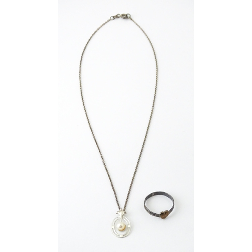 727 - A Charles Horner silver ring. Together with a silver chain and white metal pendant. Ring size approx... 