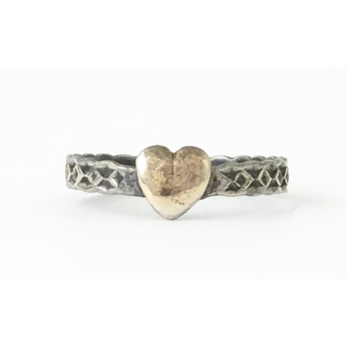 727 - A Charles Horner silver ring. Together with a silver chain and white metal pendant. Ring size approx... 