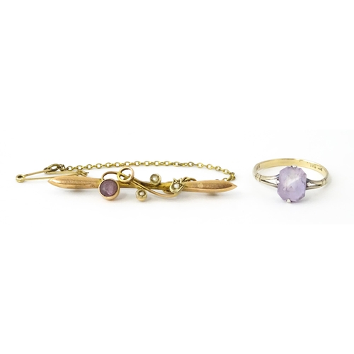 730 - A 9ct gold brooch set with amethyst with seed pearls. Together with a ring set  with amethyst and ma... 