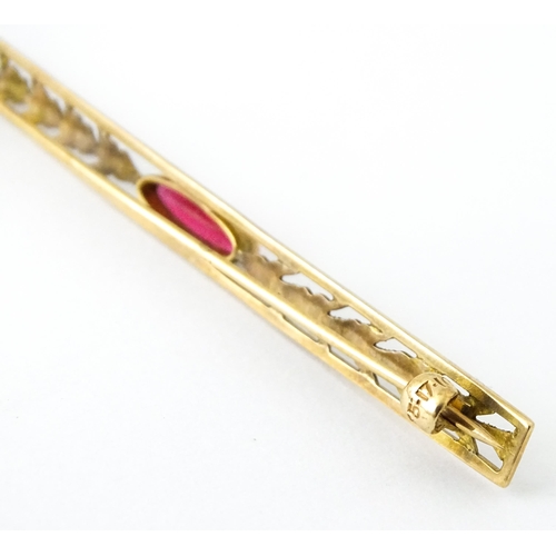 731 - A 10k bar brooch together with various gilt metal and yellow metal brooches and rings