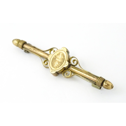 731 - A 10k bar brooch together with various gilt metal and yellow metal brooches and rings