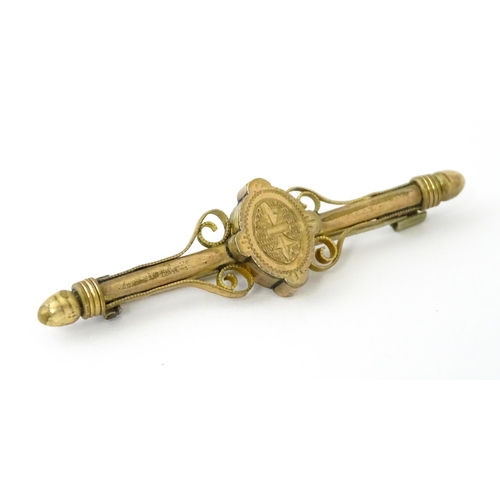 731 - A 10k bar brooch together with various gilt metal and yellow metal brooches and rings