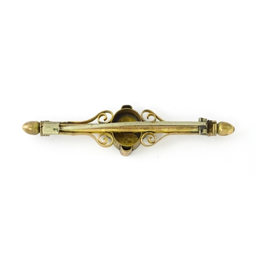 731 - A 10k bar brooch together with various gilt metal and yellow metal brooches and rings