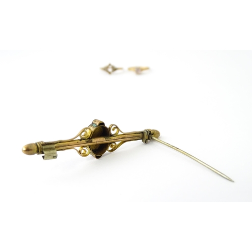 731 - A 10k bar brooch together with various gilt metal and yellow metal brooches and rings