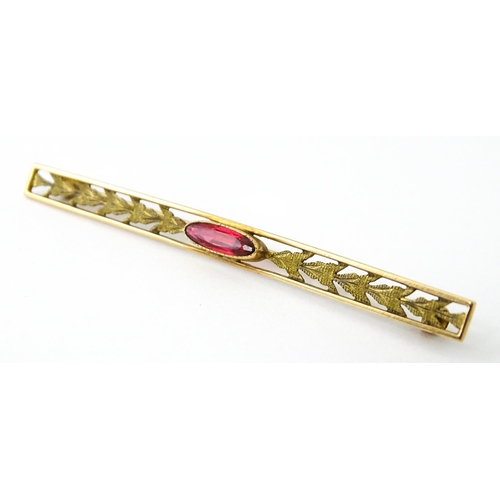 731 - A 10k bar brooch together with various gilt metal and yellow metal brooches and rings