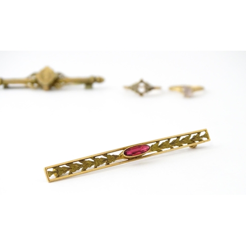 731 - A 10k bar brooch together with various gilt metal and yellow metal brooches and rings