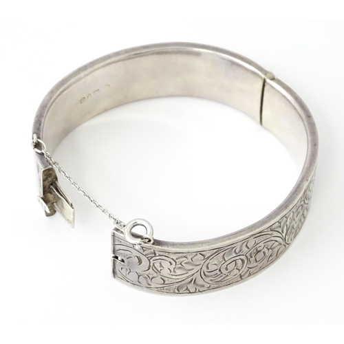 732 - A silver bracelet of bangle form. Hallmarked Chester 1953