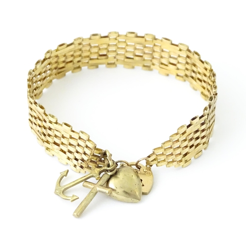 736 - A 9ct gold bracelet with padlock formed clasp. Approx 7