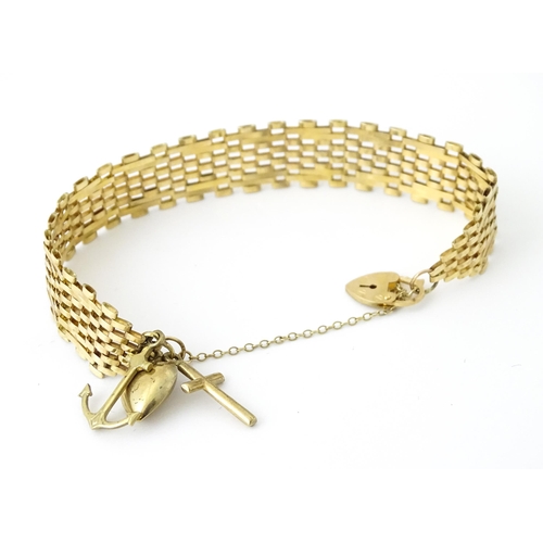 736 - A 9ct gold bracelet with padlock formed clasp. Approx 7