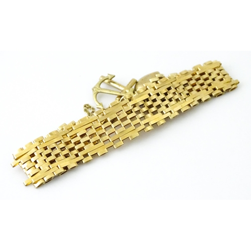 736 - A 9ct gold bracelet with padlock formed clasp. Approx 7