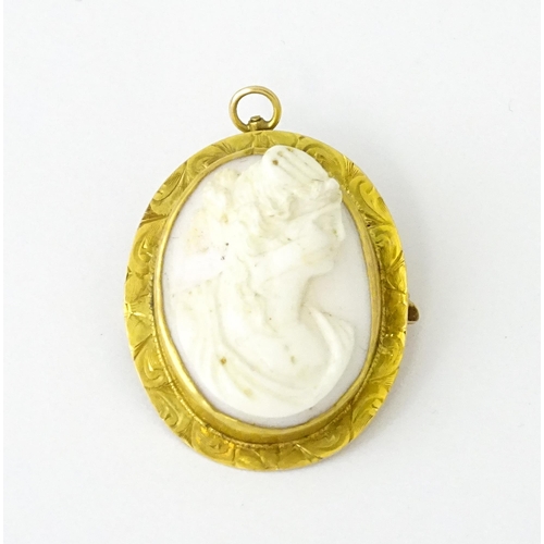 741 - A Cameo brooch with relief decoration of a female bust within a yellow metal surround. 1 1/4