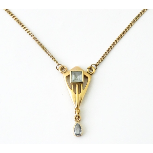 744 - A 9ct gold Arts & Crafts style pendant necklace set with aquamarine. Pendant approx. 1