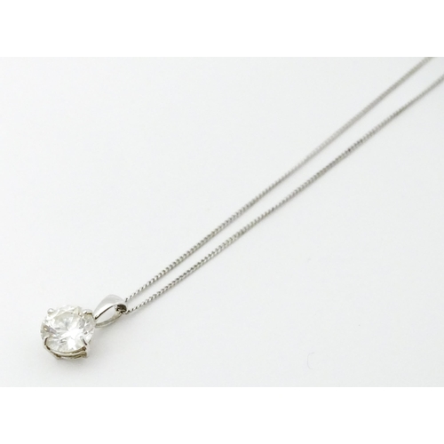 747 - A 9ct white gold necklace with pendant set with white stone/ the chain approx 14