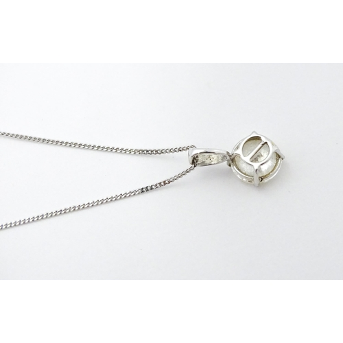 747 - A 9ct white gold necklace with pendant set with white stone/ the chain approx 14