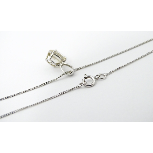 747 - A 9ct white gold necklace with pendant set with white stone/ the chain approx 14