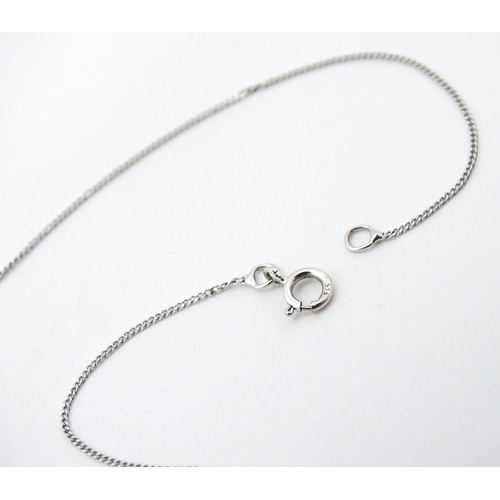 747 - A 9ct white gold necklace with pendant set with white stone/ the chain approx 14