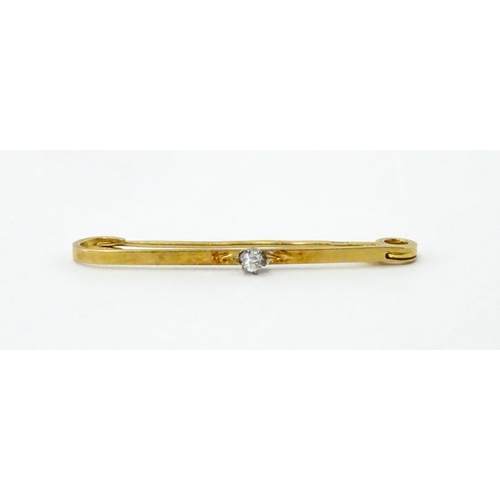 748 - An 18ct gold bar brooch set with diamond. Approx. 1 1/2