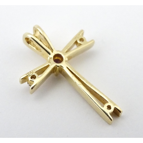 749 - A 14ct gold pendant of cross form set with amethysts and diamonds. Approx. 1