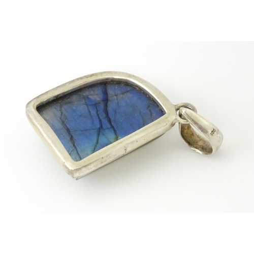 752 - Three 20thC Modernist silver pendants, one set with labradorite, another with red hardstone detail, ... 