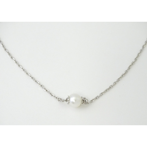 754 - An 18ct white gold necklace set with four pearls. Approx. 20