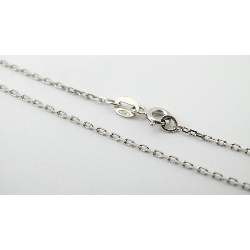 754 - An 18ct white gold necklace set with four pearls. Approx. 20