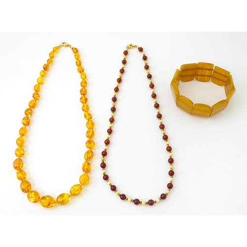 757 - A quantity of assorted jewellery to include amber bead necklaces, etc.