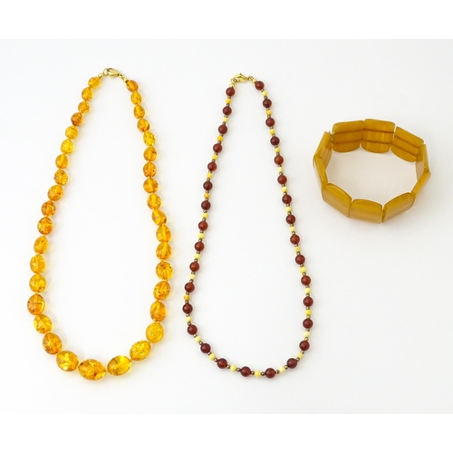 757 - A quantity of assorted jewellery to include amber bead necklaces, etc.