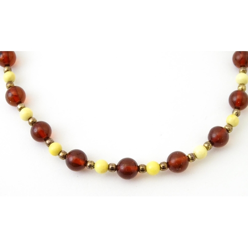 757 - A quantity of assorted jewellery to include amber bead necklaces, etc.