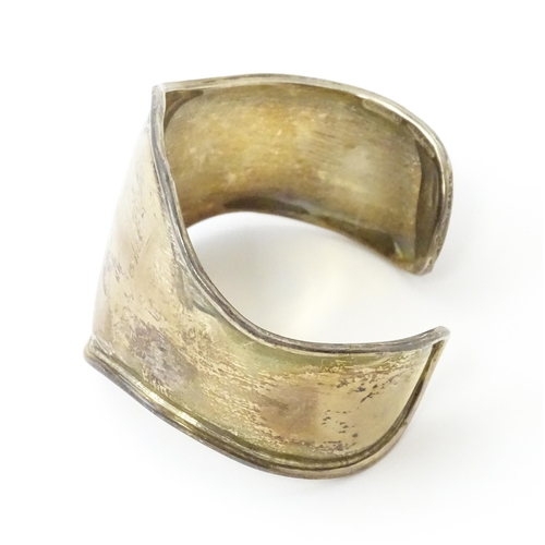 758 - Four silver / white bracelets of bangle form to include a Mexican example (4)