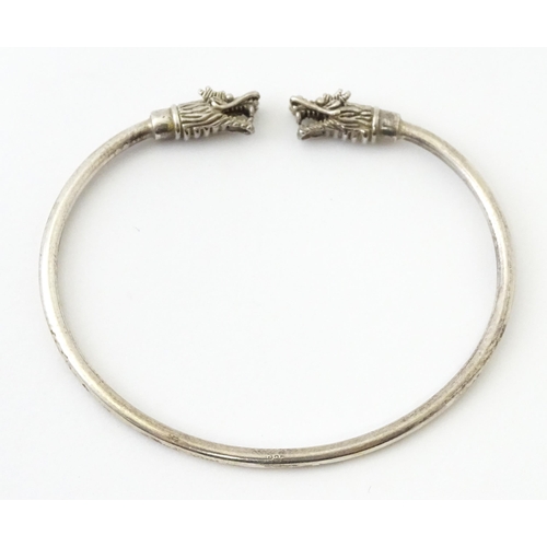 758 - Four silver / white bracelets of bangle form to include a Mexican example (4)