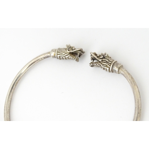 758 - Four silver / white bracelets of bangle form to include a Mexican example (4)