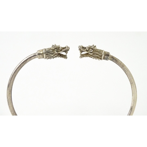 758 - Four silver / white bracelets of bangle form to include a Mexican example (4)