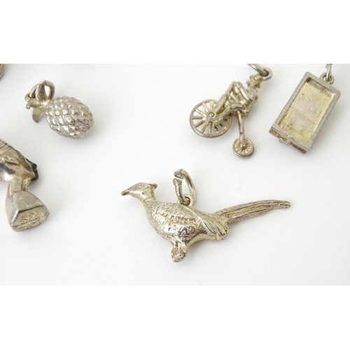 759 - A quantity of assorted white metal charms to include pheasant, flipper, mousetrap, pineapple, hedgeh... 